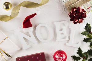 noel inscription near christmas decorations